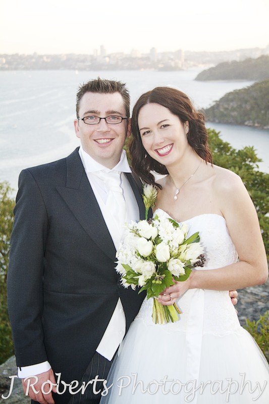 Bride and groom in front of Sydney harbour at Sunset from Georges Head - wedding photography sydney